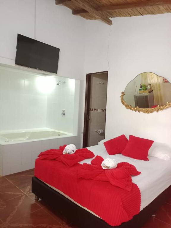 Postel nebo postele na pokoji v ubytování Libélula finca-hotel