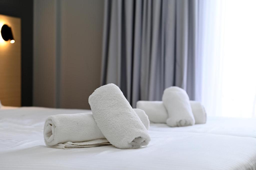 Postel nebo postele na pokoji v ubytování Onar hotel