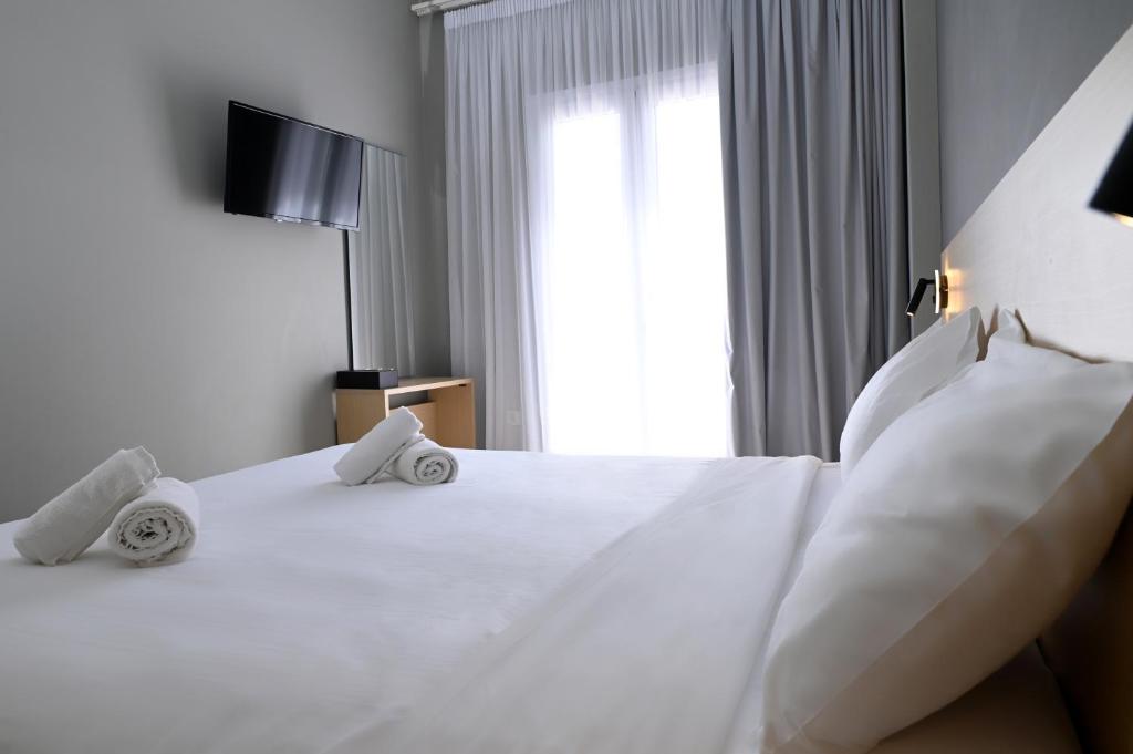 Postel nebo postele na pokoji v ubytování Onar hotel