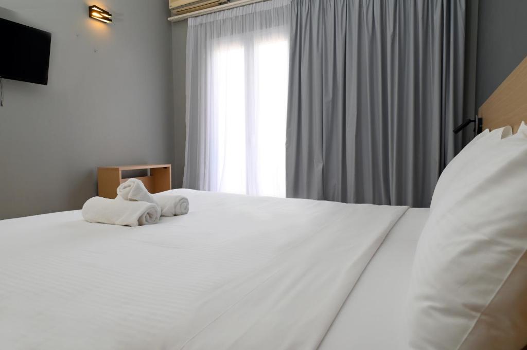 Postel nebo postele na pokoji v ubytování Onar hotel