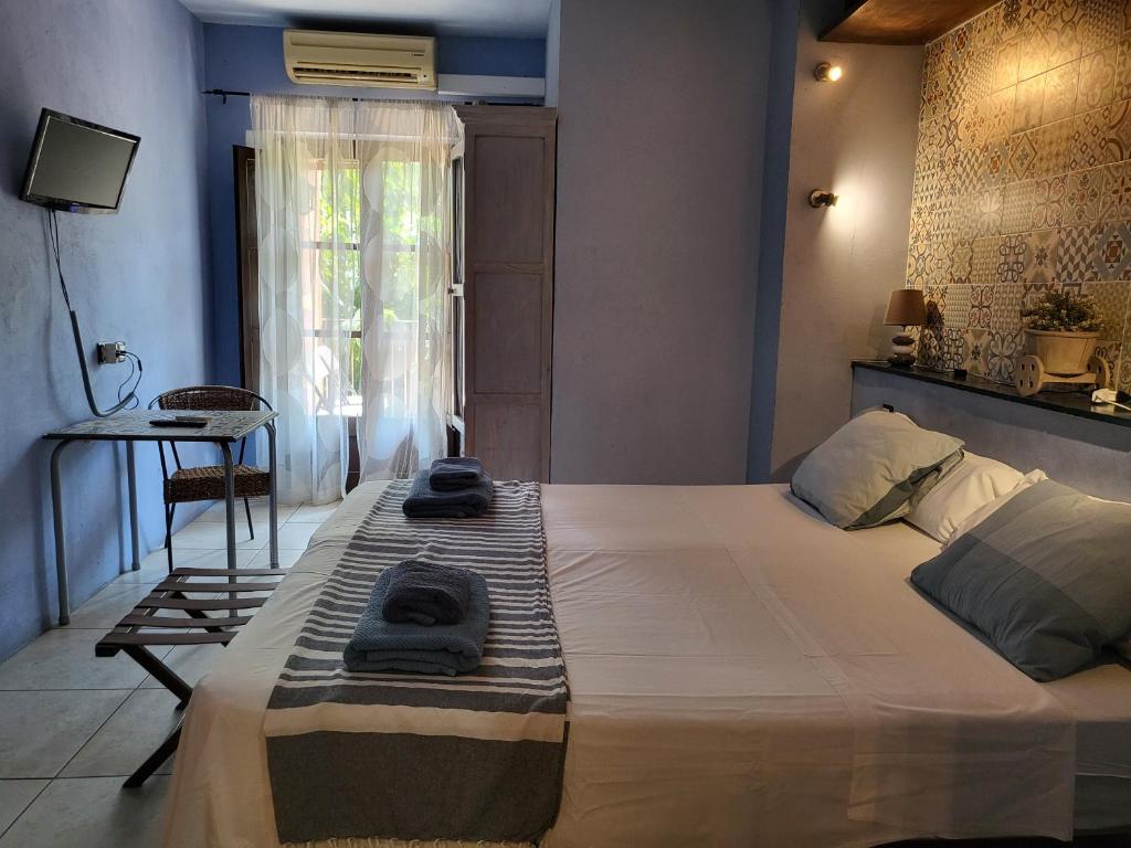 Postel nebo postele na pokoji v ubytování HOTEL PASTERAL RIU TER
