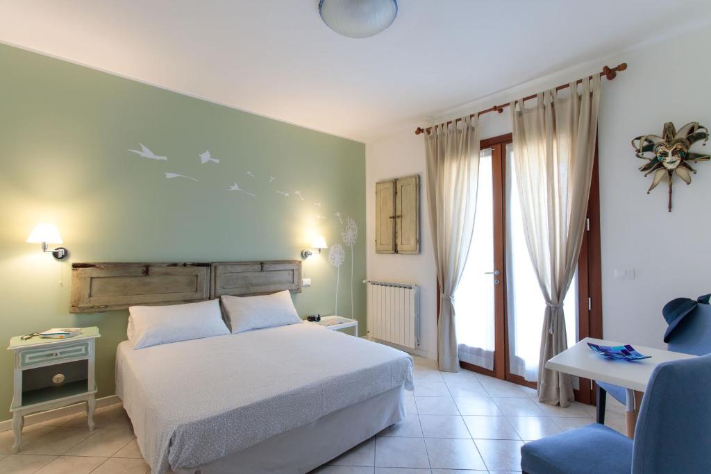 Postel nebo postele na pokoji v ubytování B&B A Casa di Marta