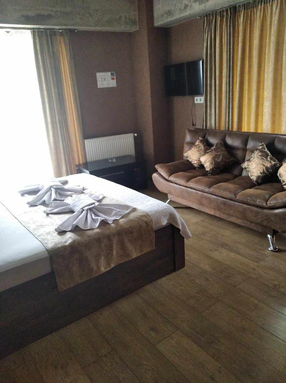 Postel nebo postele na pokoji v ubytování Magic Hotel
