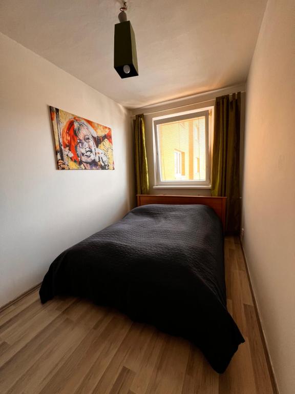 Postel nebo postele na pokoji v ubytování Apartmán širšie centrum KOCKA