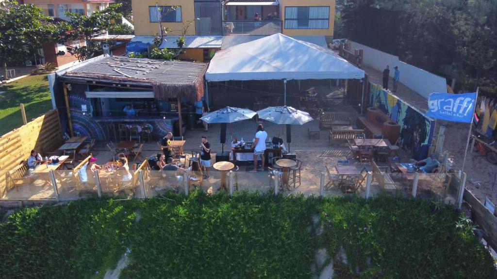 an overhead view of a restaurant with tables and umbrellas at Graffi Beach House in Florianópolis