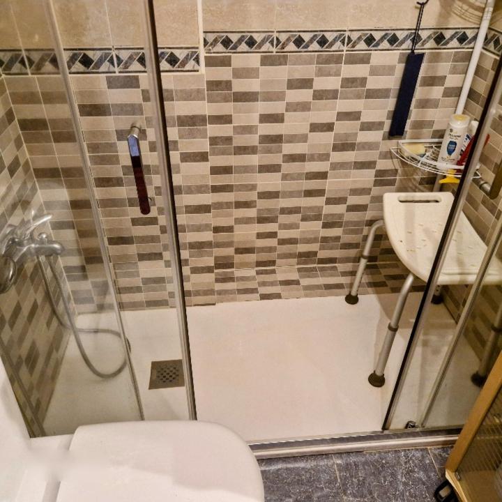 a bathroom with a shower and a toilet and a sink at Castro Urdiales in Castro-Urdiales