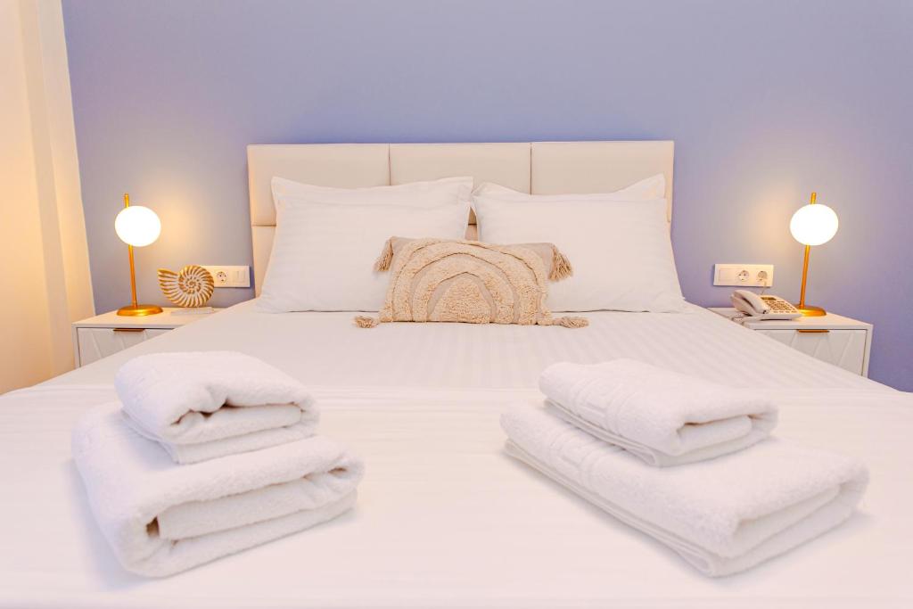 Posteľ alebo postele v izbe v ubytovaní Hotel Ilion