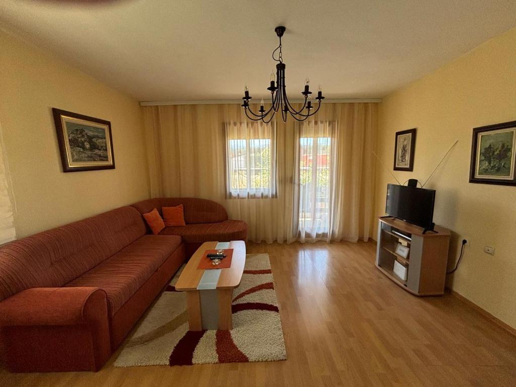 a living room with a couch and a table at Nikolija in Žabljak