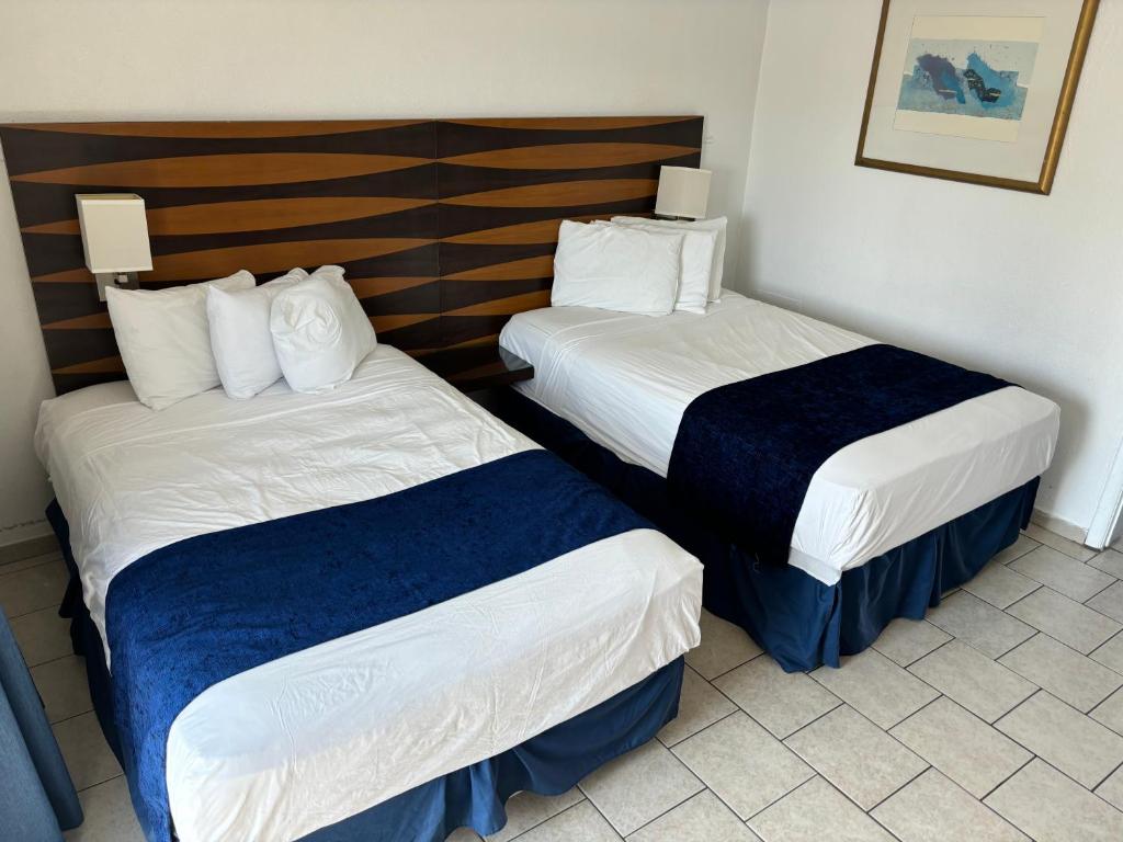 Postel nebo postele na pokoji v ubytování Brittany Motel