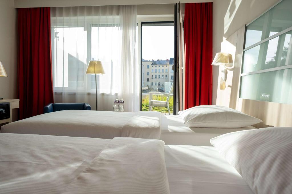 Postel nebo postele na pokoji v ubytování Park Inn by Radisson Linz