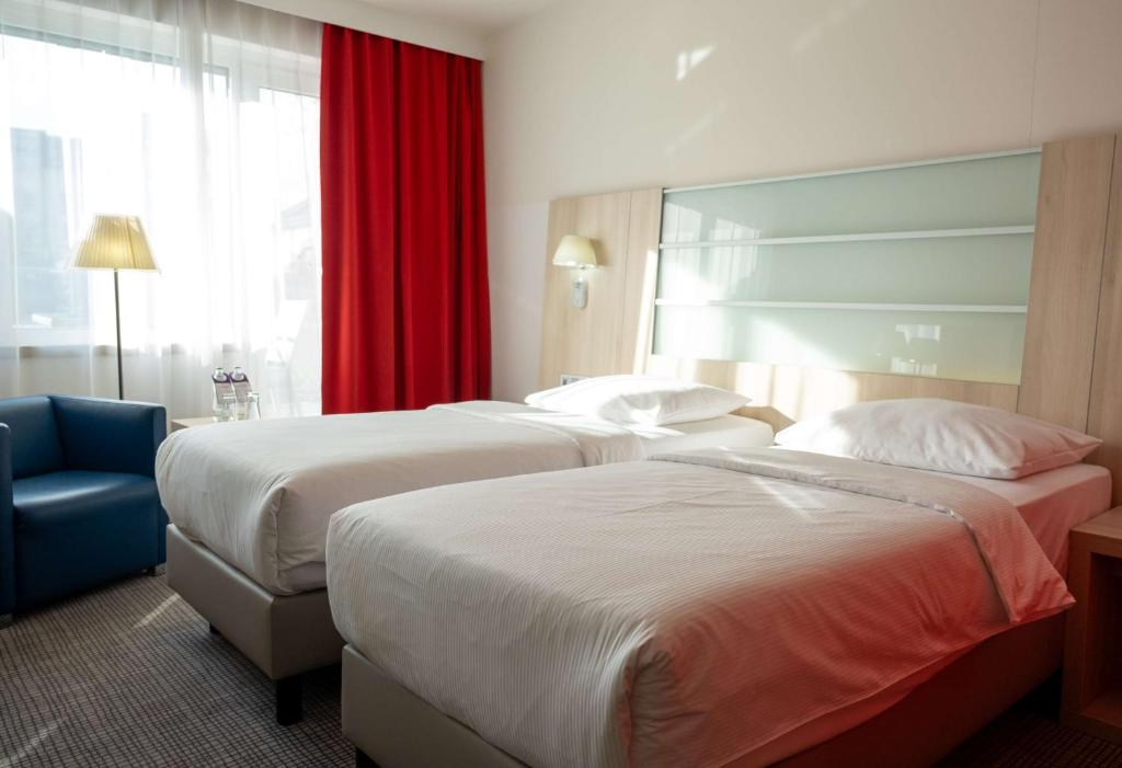 Postel nebo postele na pokoji v ubytování Park Inn by Radisson Linz