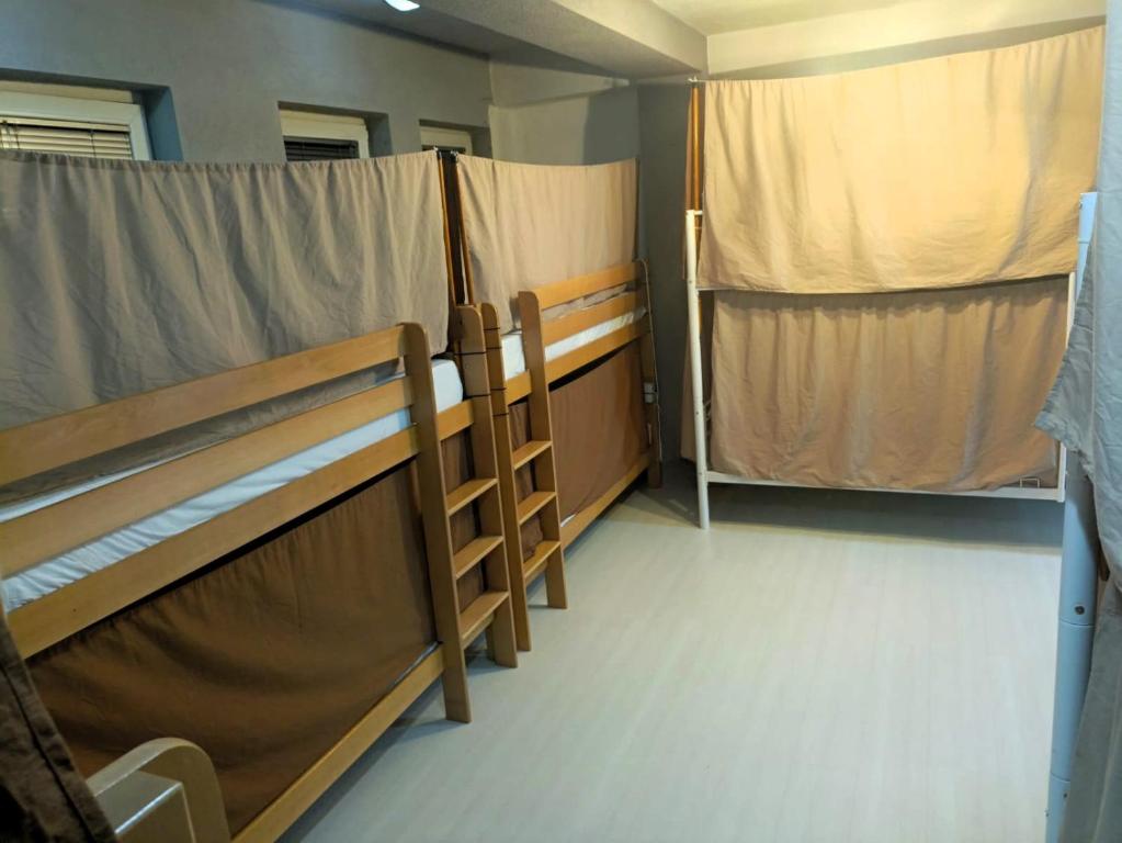 Кровать или кровати в номере Historia Hostel