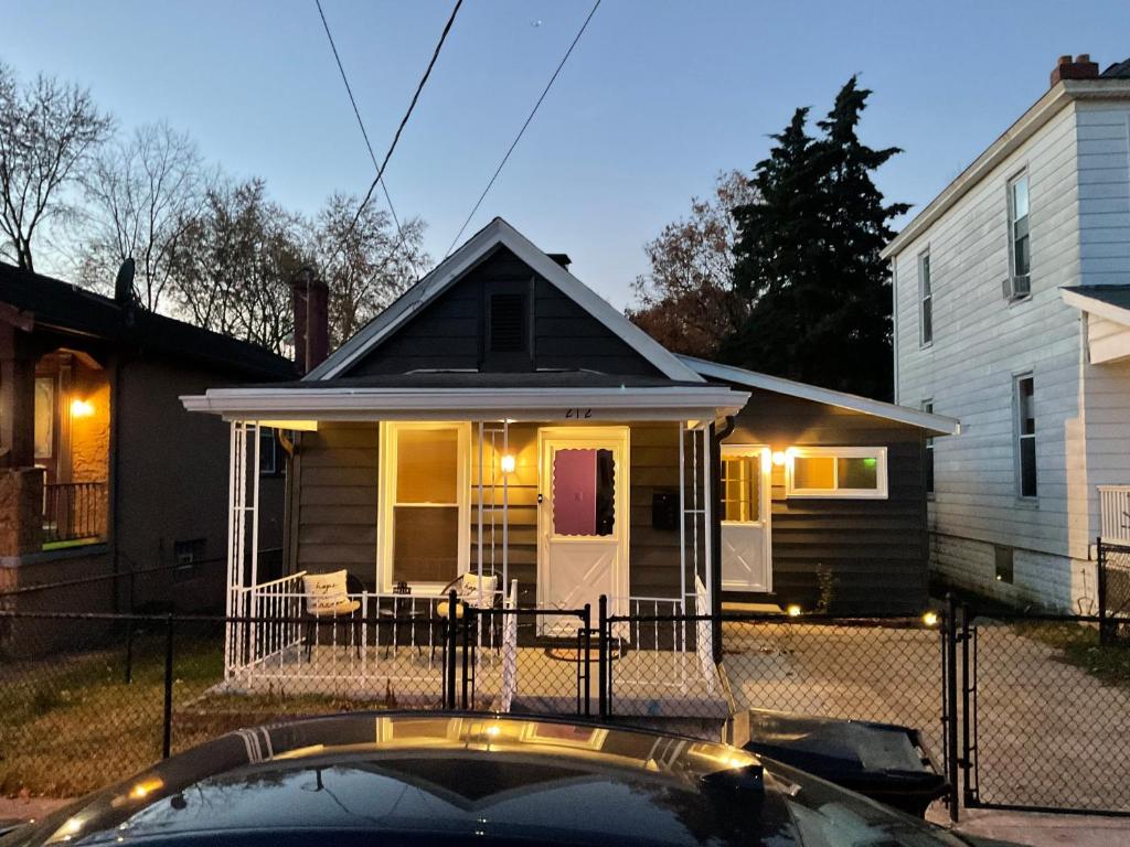 a house with a car parked in front of it at Modern Farmhouse in Covington