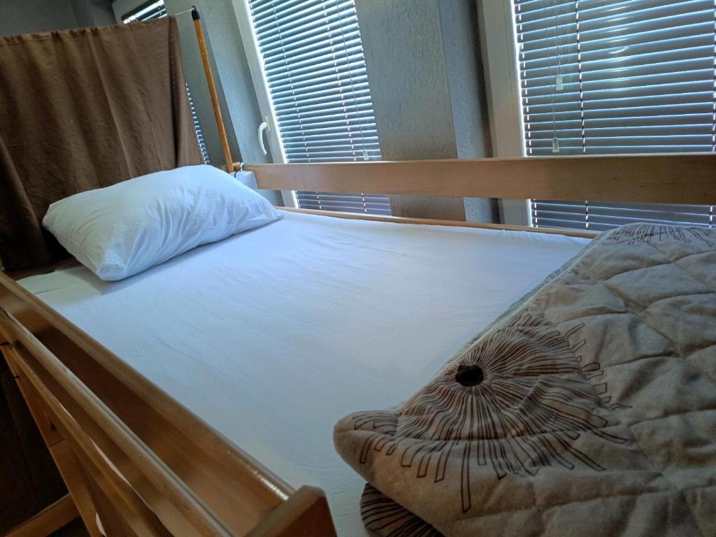 Кровать или кровати в номере Historia Hostel
