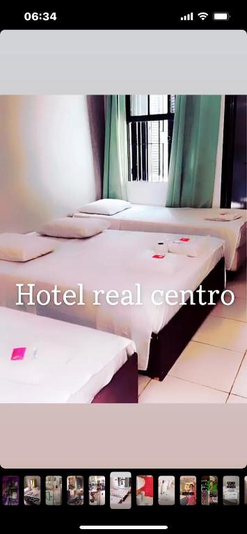 Postel nebo postele na pokoji v ubytování Hotel Real Centro