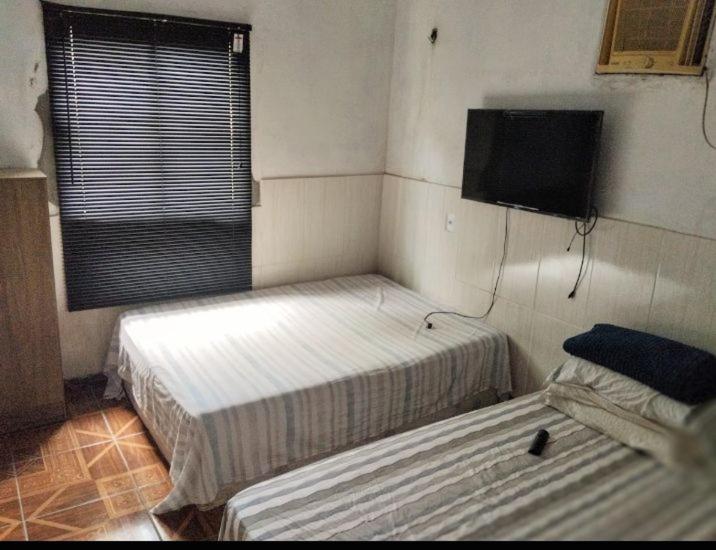Postel nebo postele na pokoji v ubytování Pousada Simas