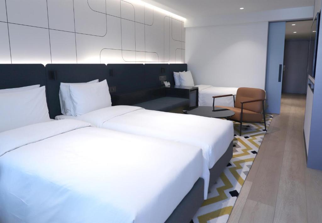 Cama ou camas em um quarto em Hotel PJ Myeongdong