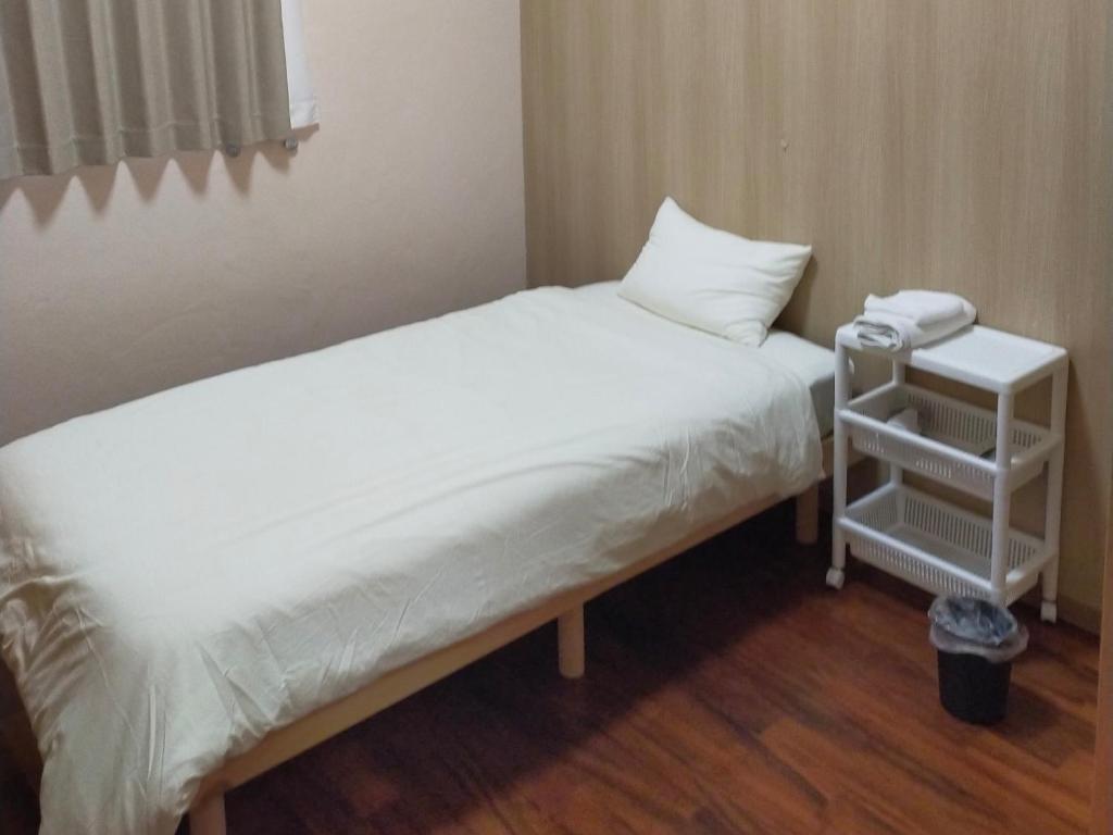 Postel nebo postele na pokoji v ubytování Horinoyado