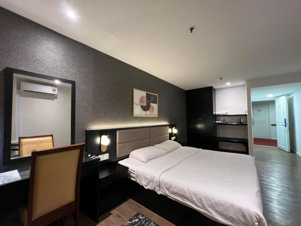 Postel nebo postele na pokoji v ubytování Remington Hotel