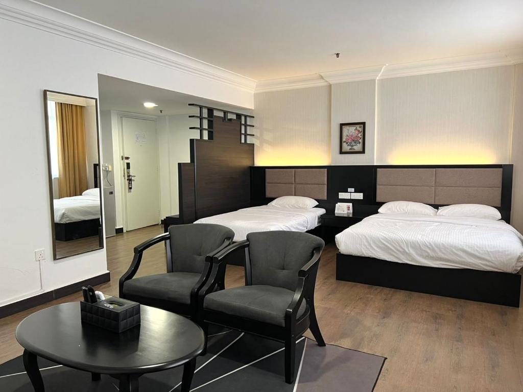 Postel nebo postele na pokoji v ubytování Remington Hotel