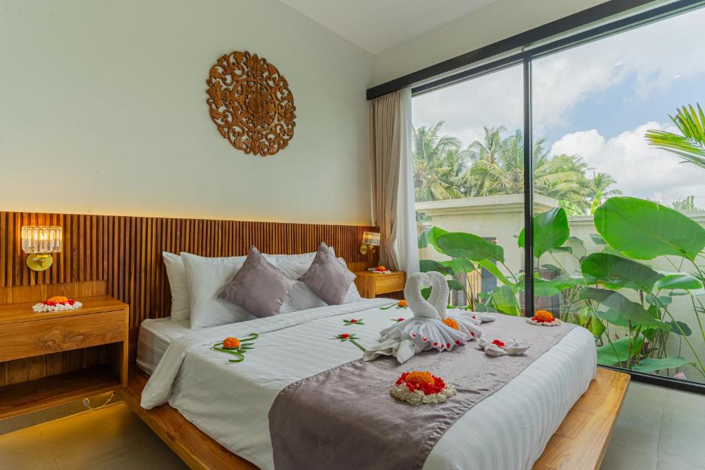 Postel nebo postele na pokoji v ubytování Abian Ubud View