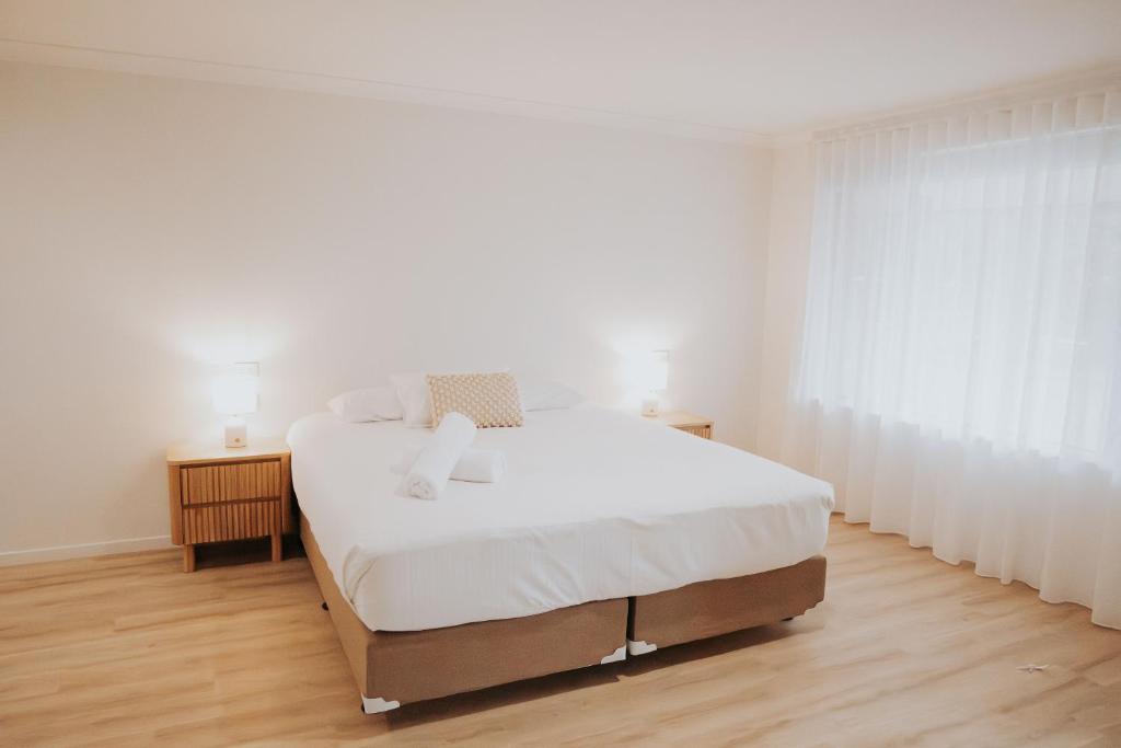 Postel nebo postele na pokoji v ubytování Greenacres Motel