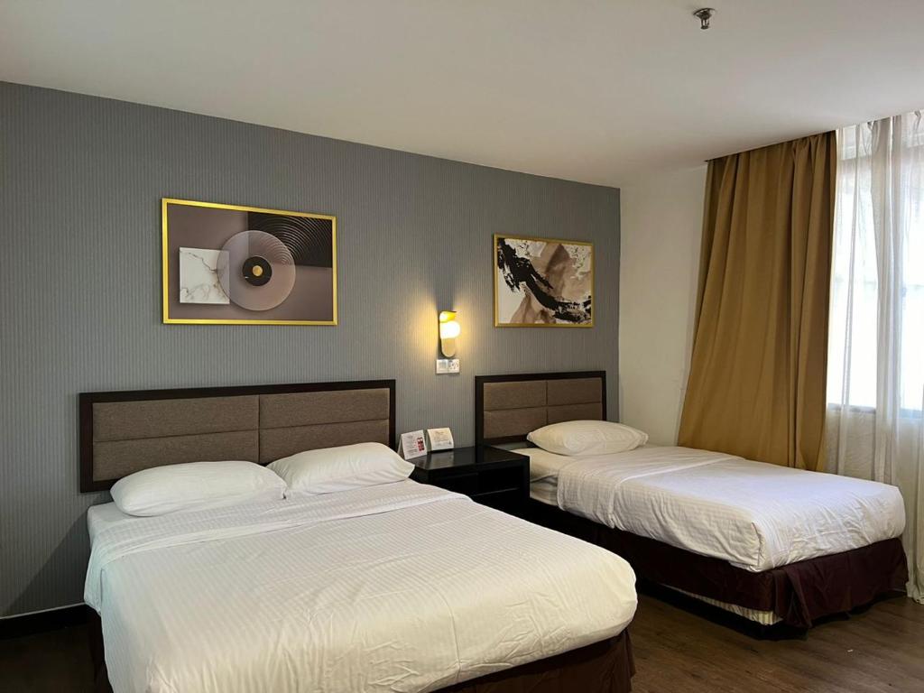 Postel nebo postele na pokoji v ubytování Remington Hotel