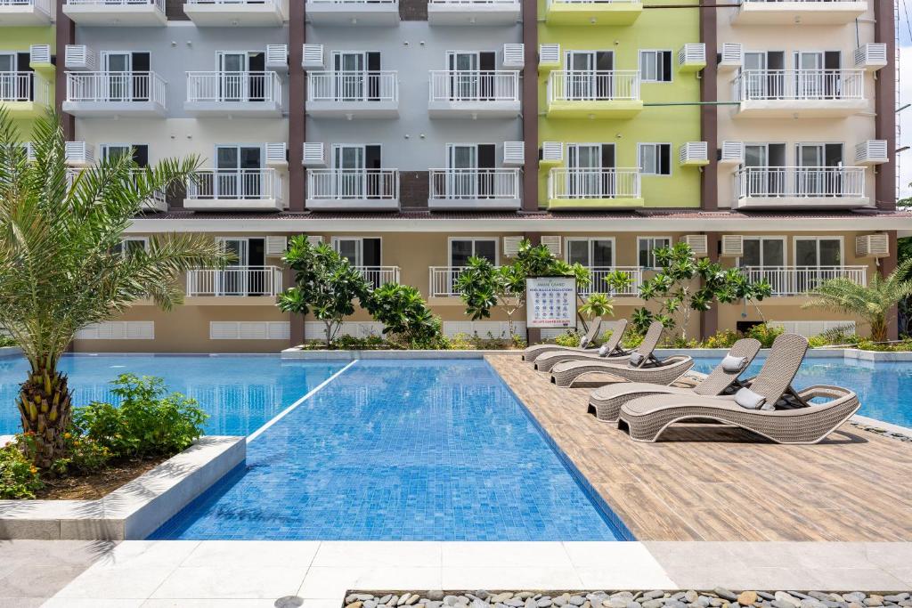 Bazén v ubytování AMANI 107B, 3 Minutes to Airport, with Gym & Pool ,FAST WIFI, Free Netflix nebo v jeho okolí