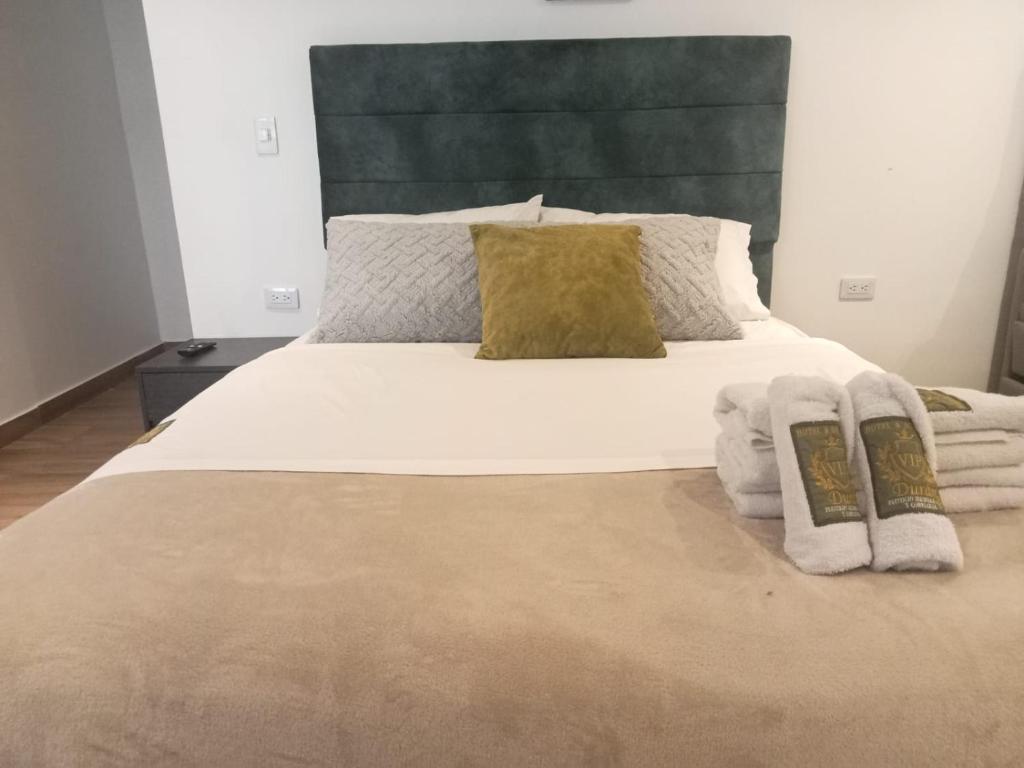 Postel nebo postele na pokoji v ubytování Dulce Hogar Colombiano