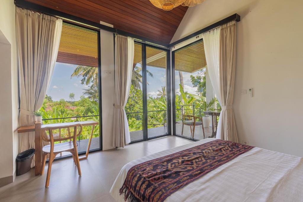 Postel nebo postele na pokoji v ubytování Abian Ubud View