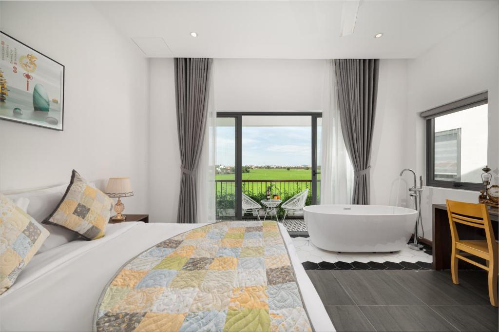 Postel nebo postele na pokoji v ubytování BS Jade Home Hội An