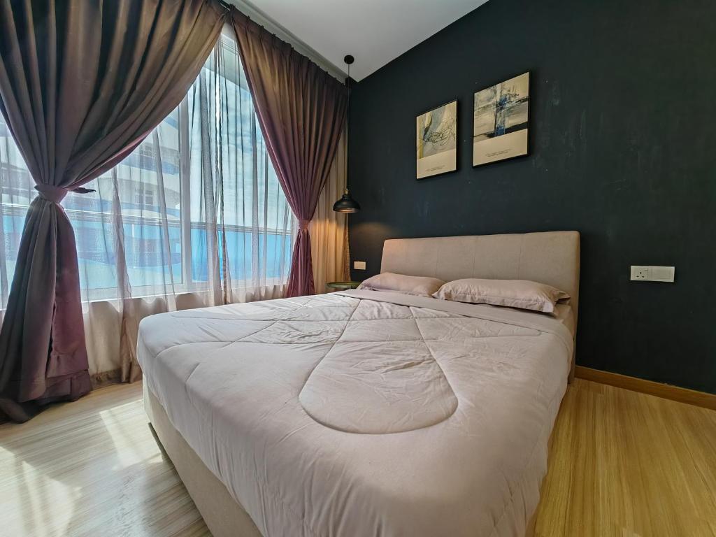 a bedroom with a large bed and a large window at Mykey The Wave B-21-15 Melaka City in Melaka
