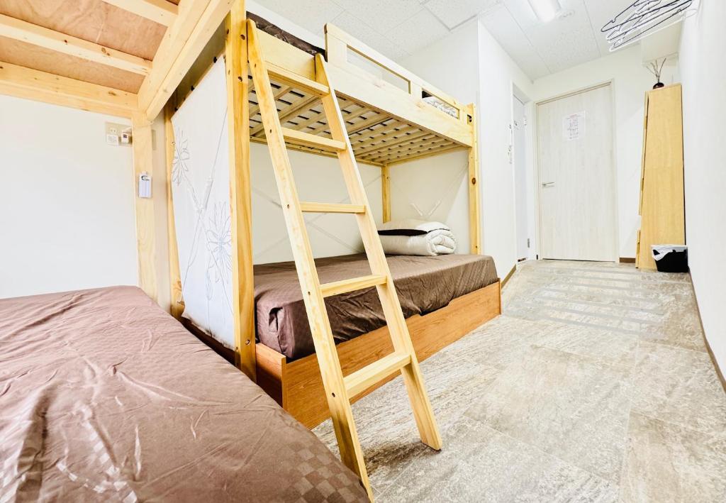 Postel nebo postele na pokoji v ubytování GUEST HOUSE B's FiveⅡ