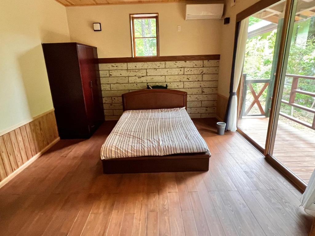 Postel nebo postele na pokoji v ubytování 流景邸