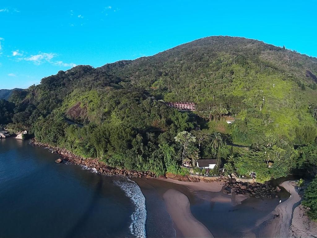 
a scenic view of a lake and mountains at Pousada Preamare in Ubatuba
