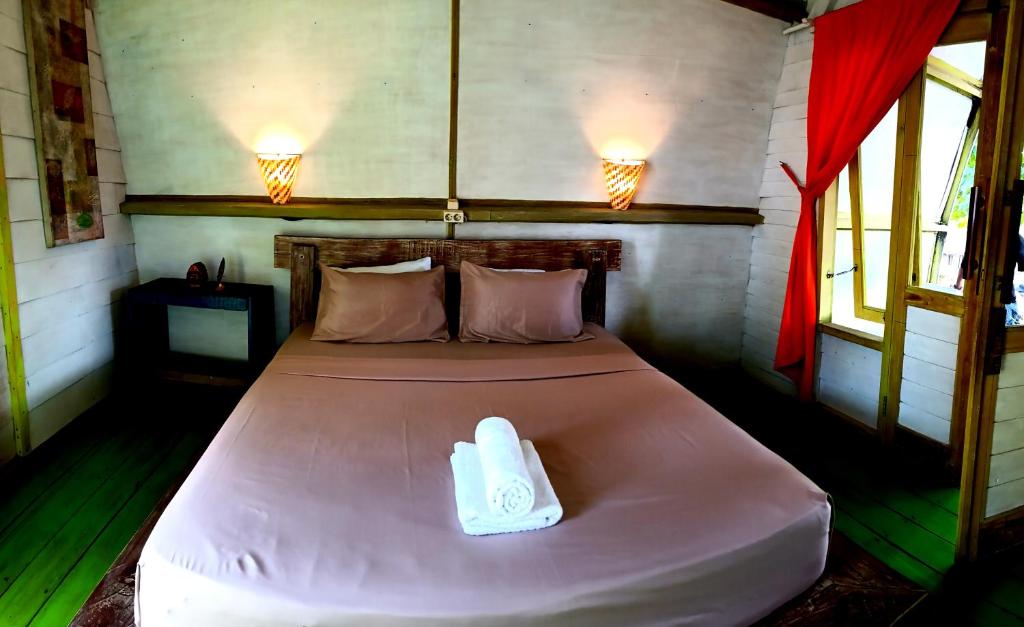 Postel nebo postele na pokoji v ubytování Oceansoul Gili Trawangan