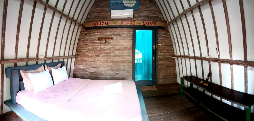 Postel nebo postele na pokoji v ubytování Oceansoul Gili Trawangan