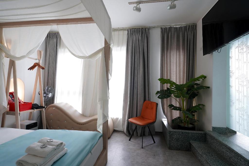 Postel nebo postele na pokoji v ubytování 69 Boutique by Minova