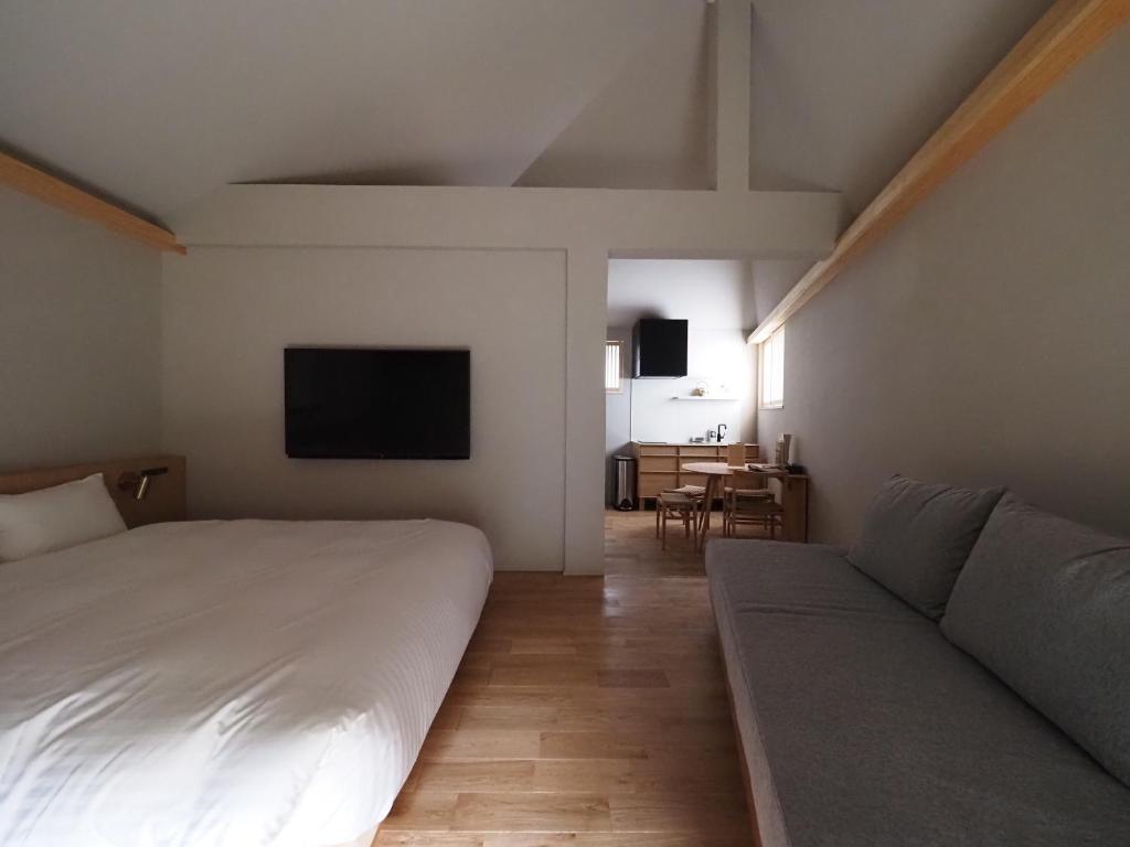 Postel nebo postele na pokoji v ubytování HIYASAI -LOGIN Kurashiki-