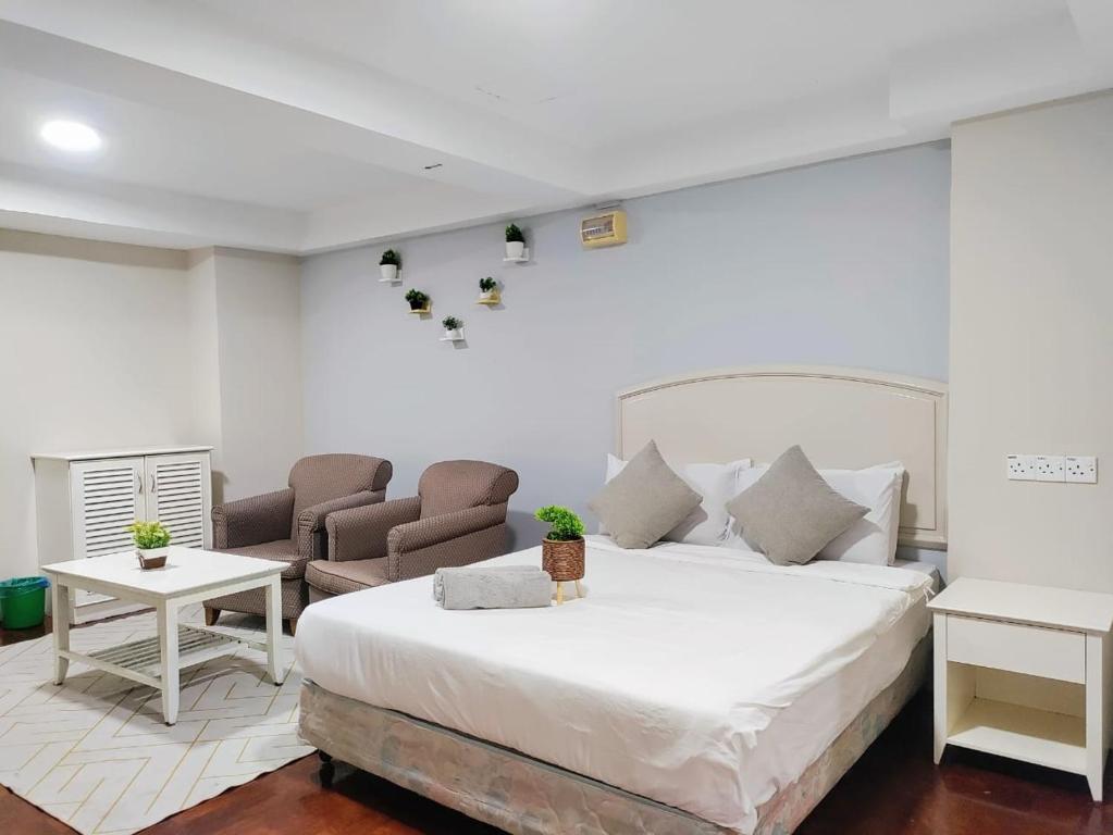 Postel nebo postele na pokoji v ubytování The Little Star Studio Hotel- Star Regency