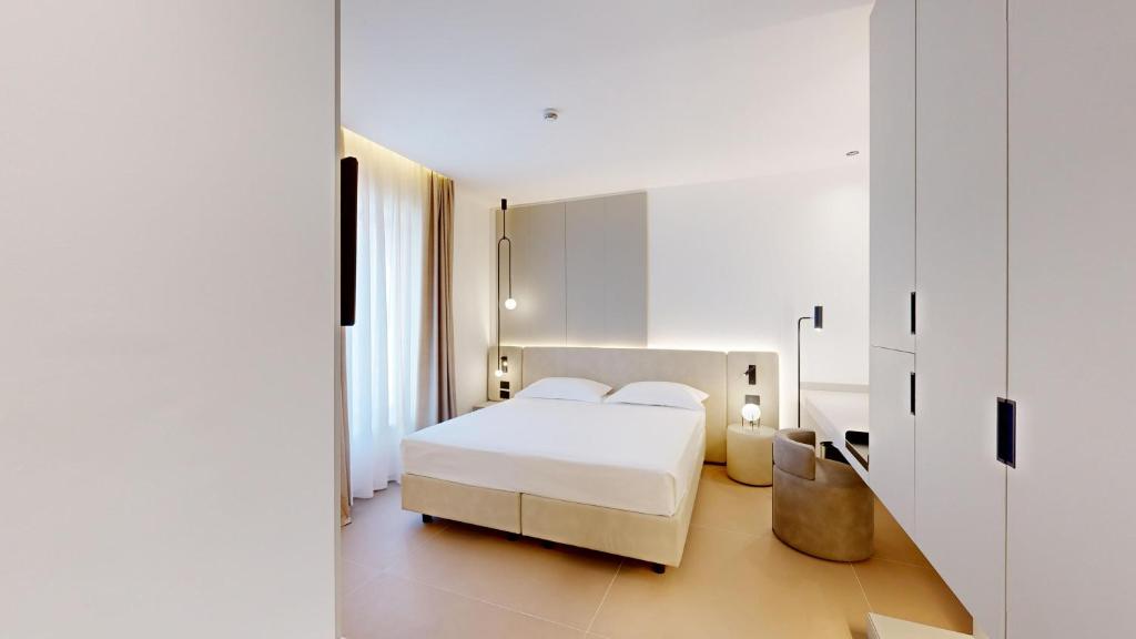 Postel nebo postele na pokoji v ubytování PRIMO OSTUNI HOTEL