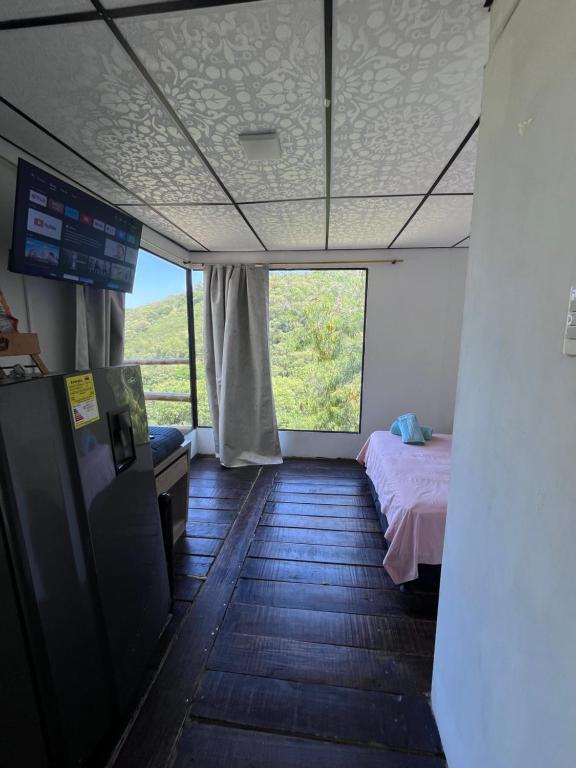 Ένα ή περισσότερα κρεβάτια σε δωμάτιο στο Glamping girardot- finca la perla