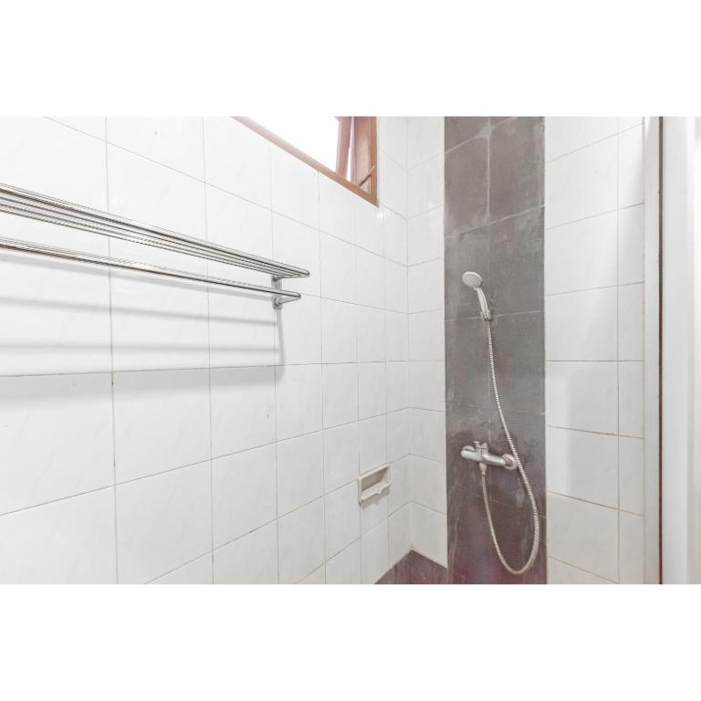 Koupelna v ubytování Urbanview Hotel Utari
