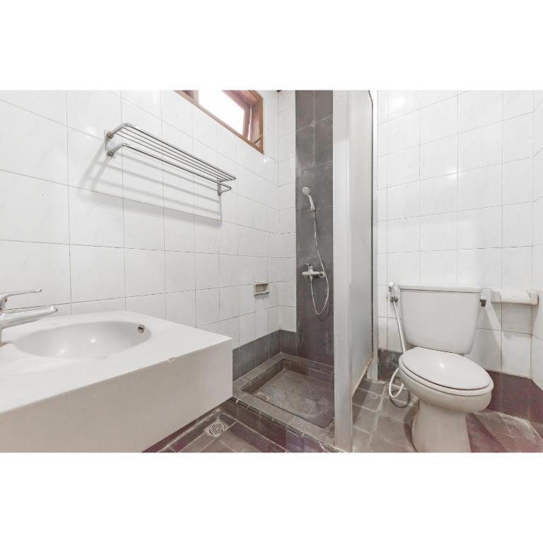 Koupelna v ubytování Urbanview Hotel Utari