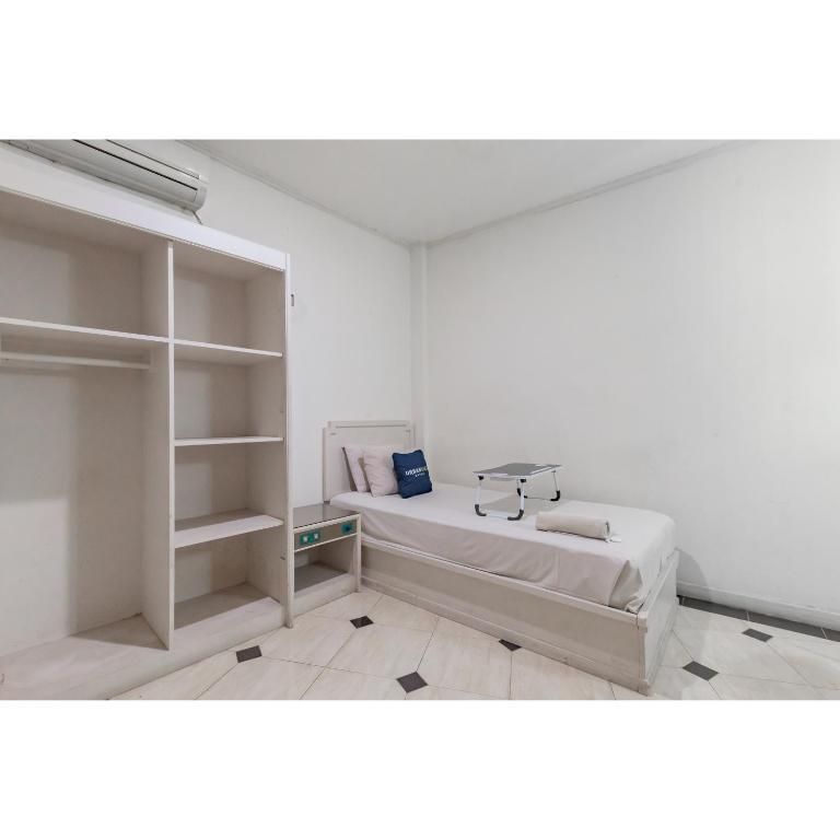 Postel nebo postele na pokoji v ubytování Urbanview Hotel Utari