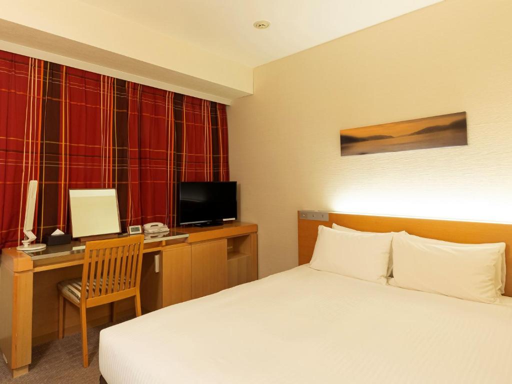 TV a/nebo společenská místnost v ubytování Hotel Keihan Kyobashi Grande