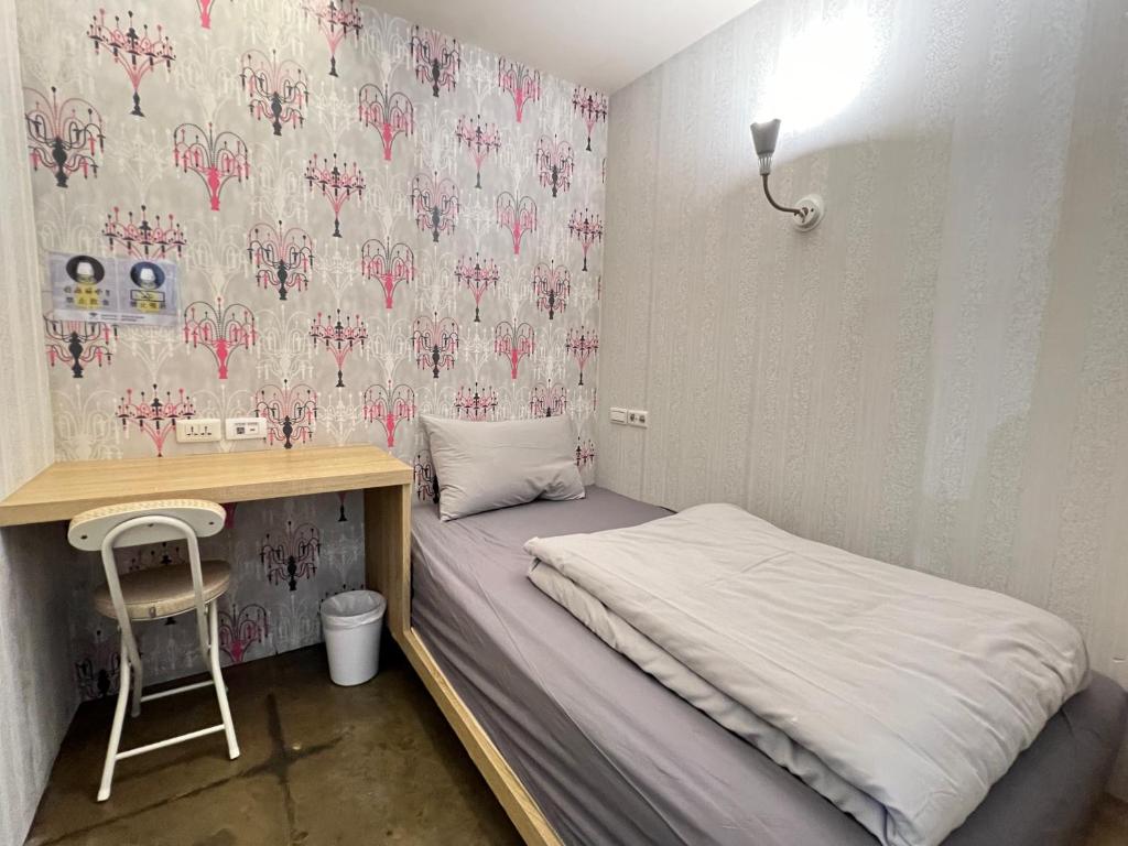 Postel nebo postele na pokoji v ubytování WORK INN TPE