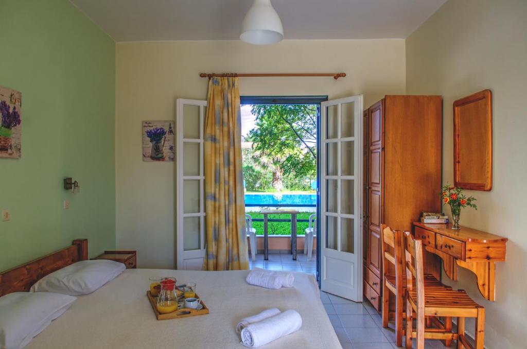 Postel nebo postele na pokoji v ubytování Jasmine Apartments