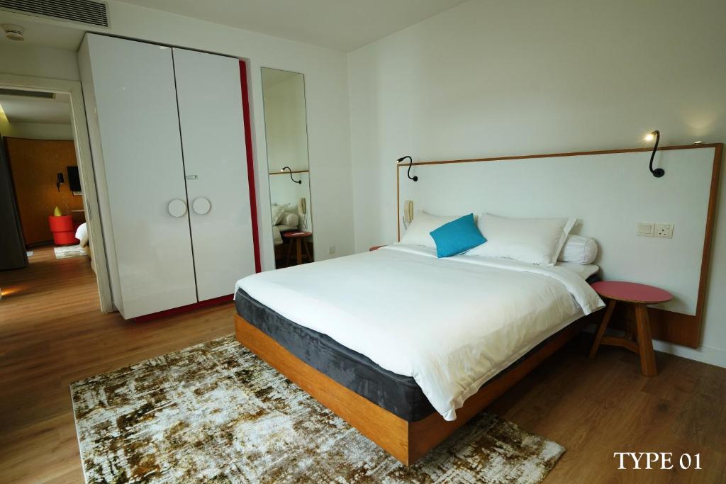 Postel nebo postele na pokoji v ubytování MU Hotel