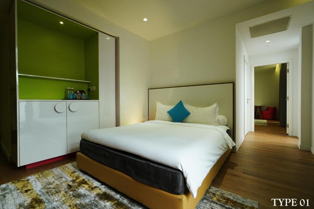 Postel nebo postele na pokoji v ubytování MU Hotel